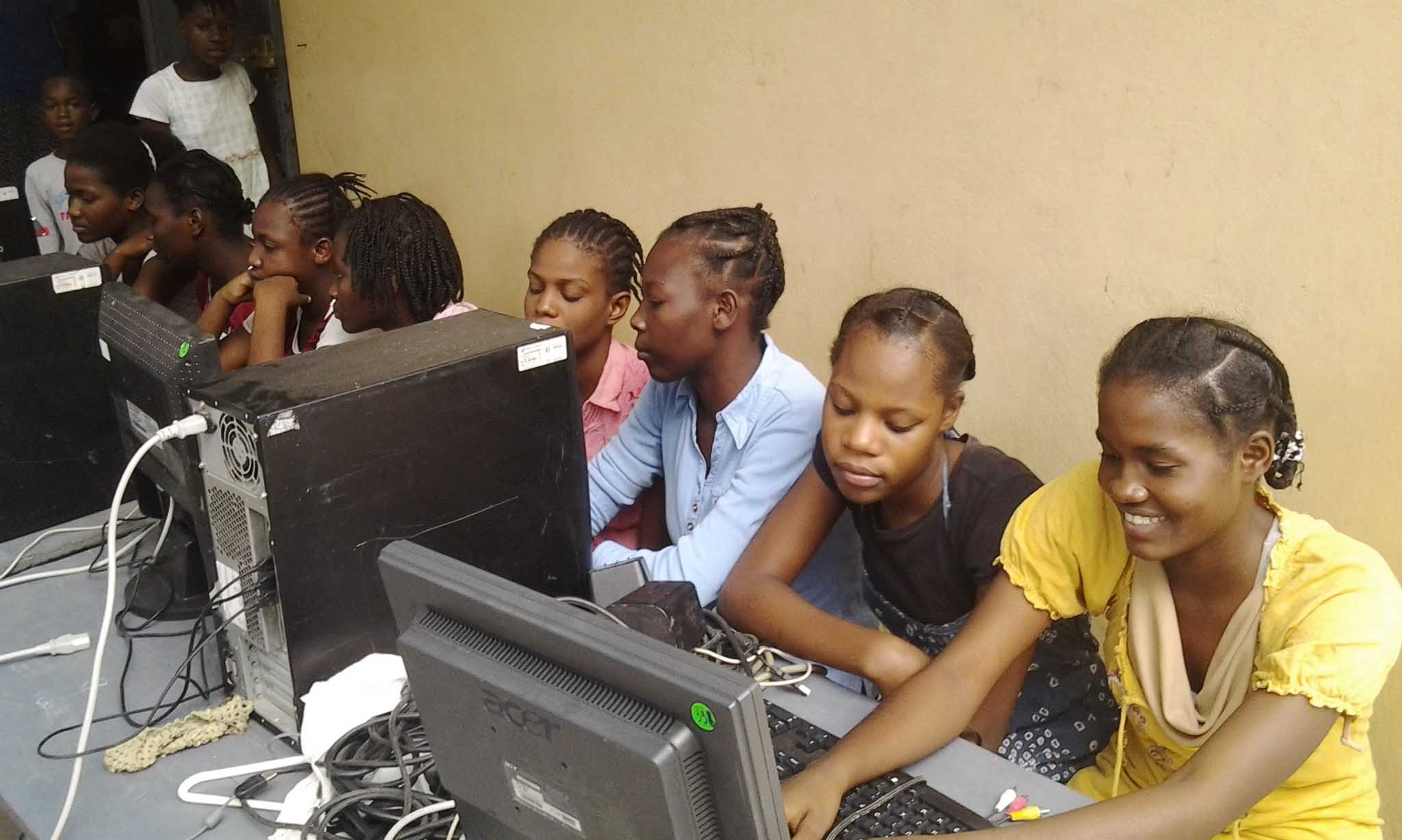 Haitian girls working on desktop computers