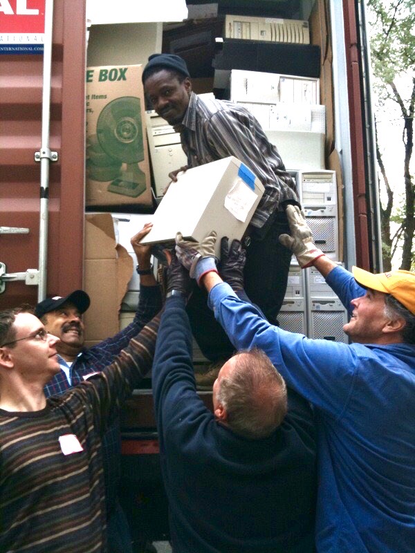 Tim Anderson and volunteers loading a container